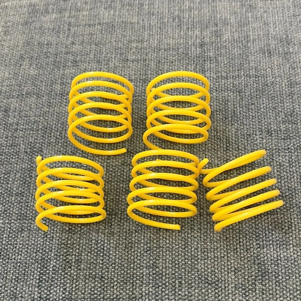5 Gently Used Yellow Cat Spring Toys
